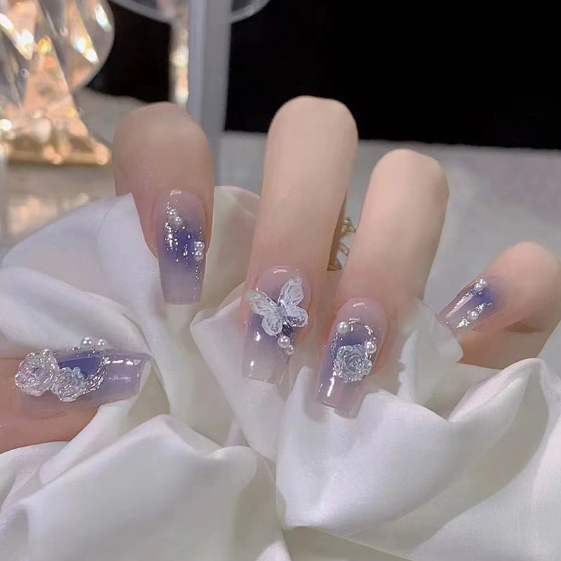 Press on Nails, Purity and charm of a fairy-like aura, wearing a combination of blue-tinted smoky aura butterfly and Camellia flowers on nails