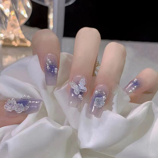 Press on Nails, Purity and charm of a fairy-like aura, wearing a combination of blue-tinted smoky aura butterfly and Camellia flowers on nails