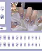 Press on Nails, Purity and charm of a fairy-like aura, wearing a combination of blue-tinted smoky aura butterfly and Camellia flowers on nails